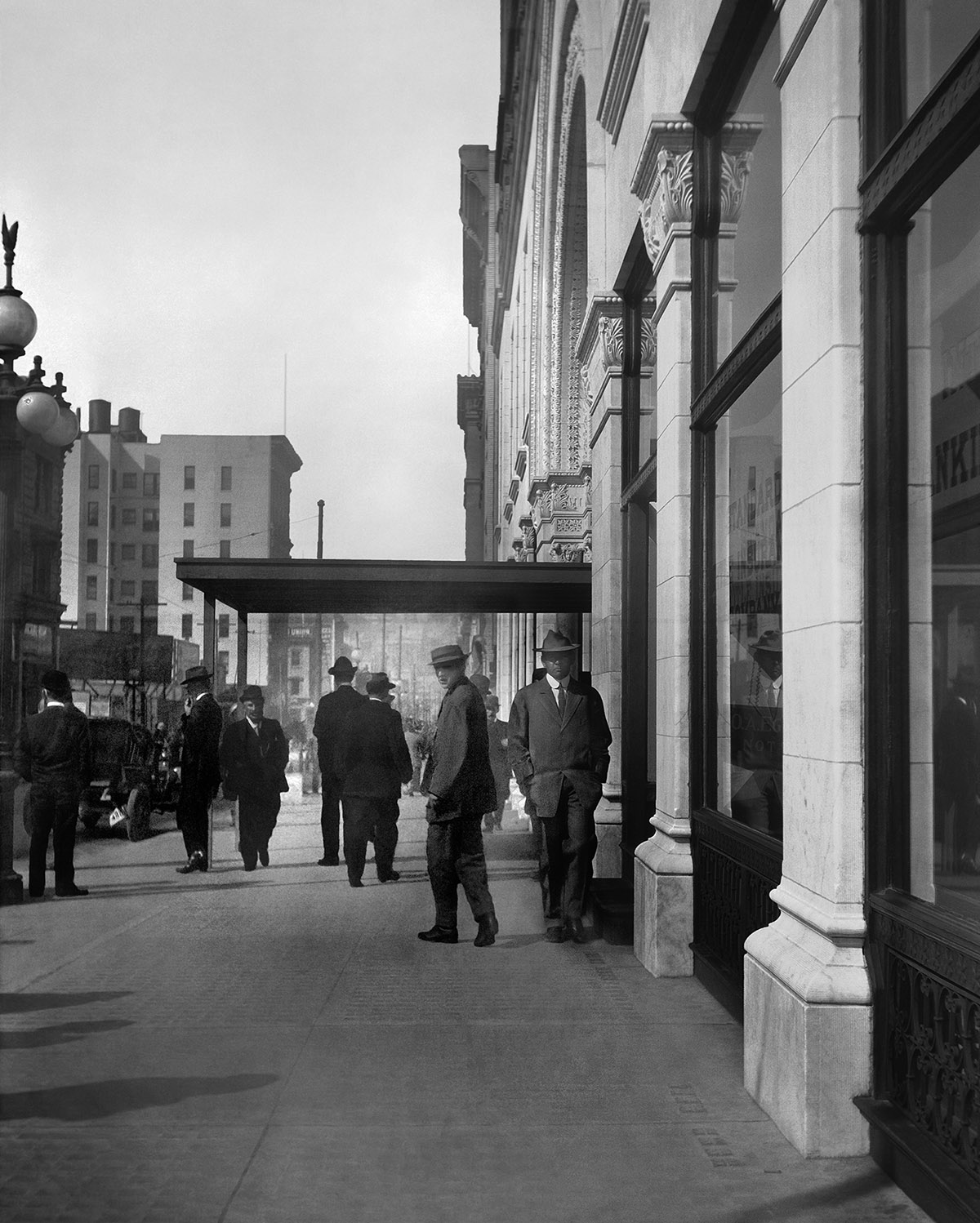Historical photo of people just outside the Mills Building